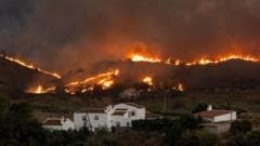 British Couple Rescued from Inferno: Who's Responsible for Spain's Wildfire Crisis?